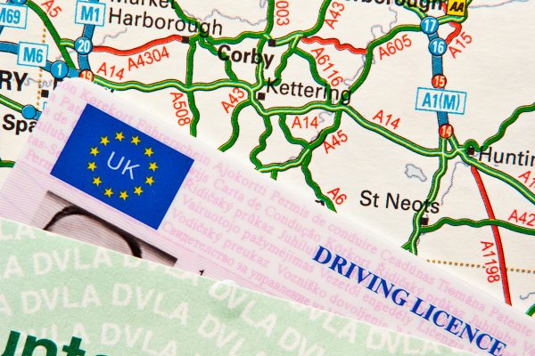 UK driving licence on UK road map around London